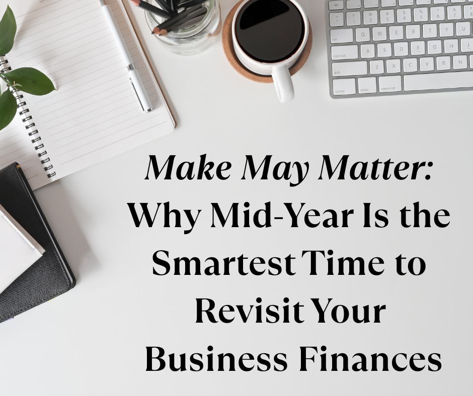 Flat lay of a modern desk setup with a notebook, keyboard, coffee cup, and office supplies beside the title text “Make May Matter: Why Mid-Year Is the Smartest Time to Revisit Your Business Finances,” emphasizing small business financial planning.